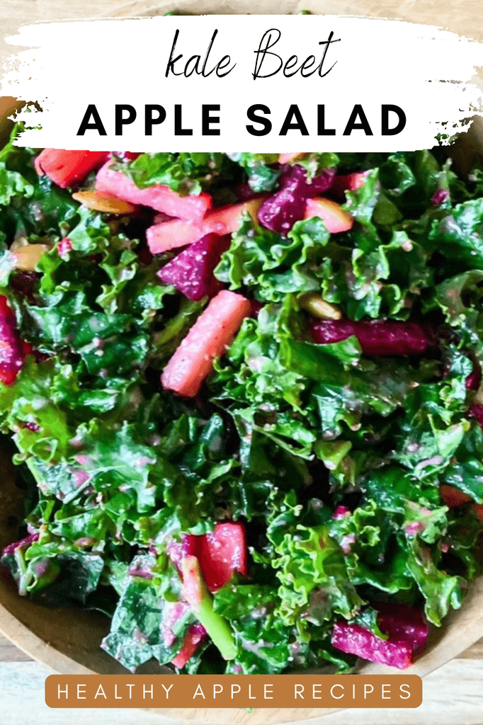 Close up of a kale beet apple salad in a wooden bowl and text overlay that says: kale beet apple salad - healthy apple recipes.