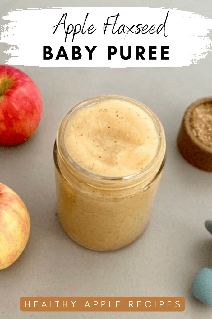 Apple flaxseed baby puree in a glass jar surrounded by fresh apples and ground flaxseed, featuring text that reads “Apple Flaxseed Baby Puree” and “Healthy Apple Recipes.”