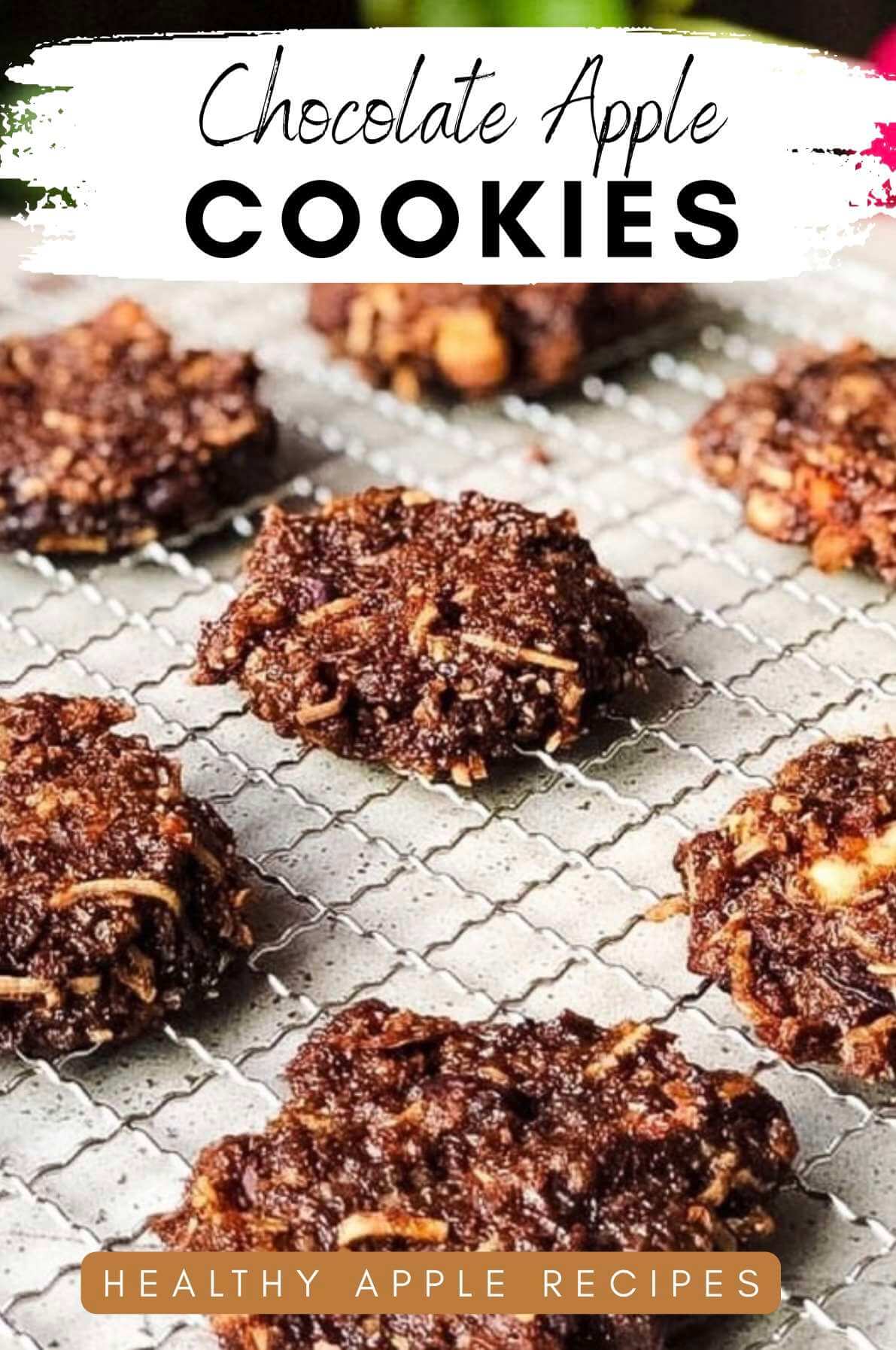 Chocolate apple cookies cooling on a wire rack.