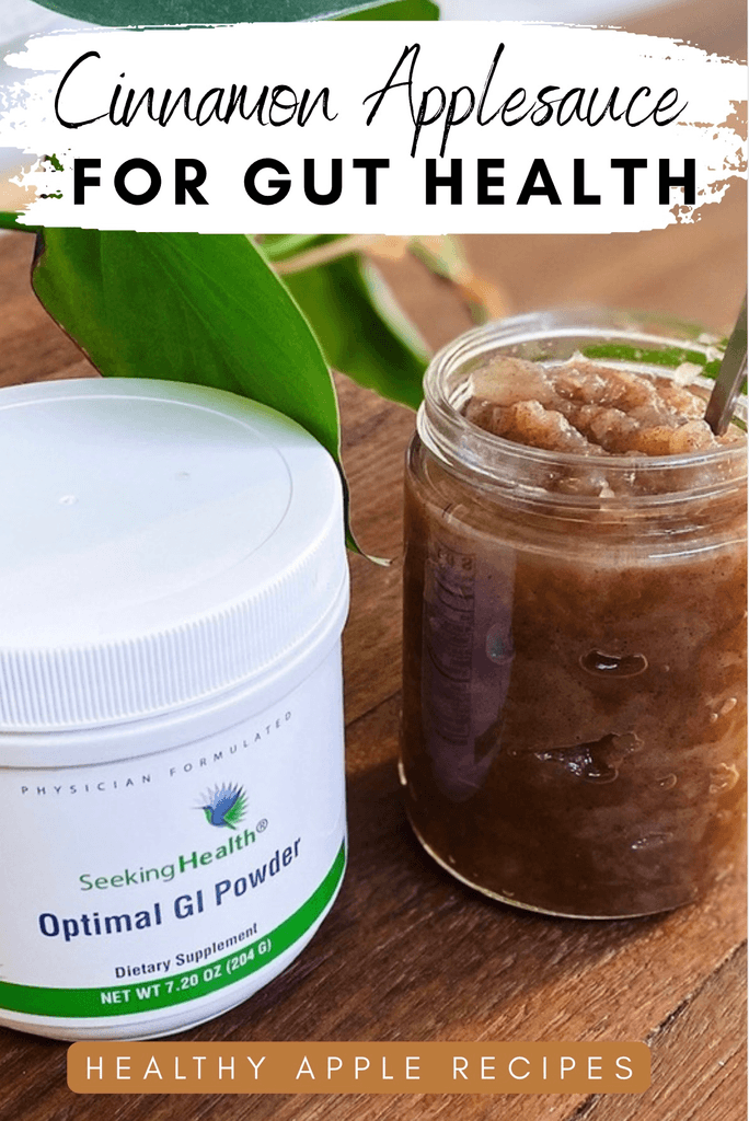 Cinnamon applesauce in a glass jar beside a container of Optimal GI Powder on a wooden surface.